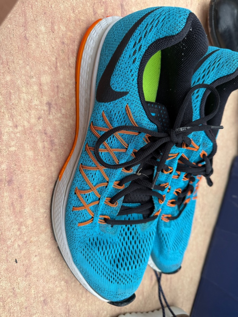Nike Men’s Teal Running Shoes with Orange Accents